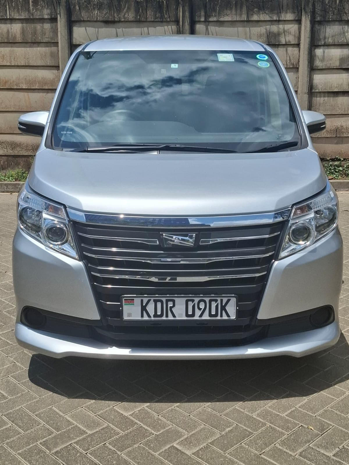 Toyota Noah sedan at Jomo Kenyatta International Airport for Nairobi airport transfer service